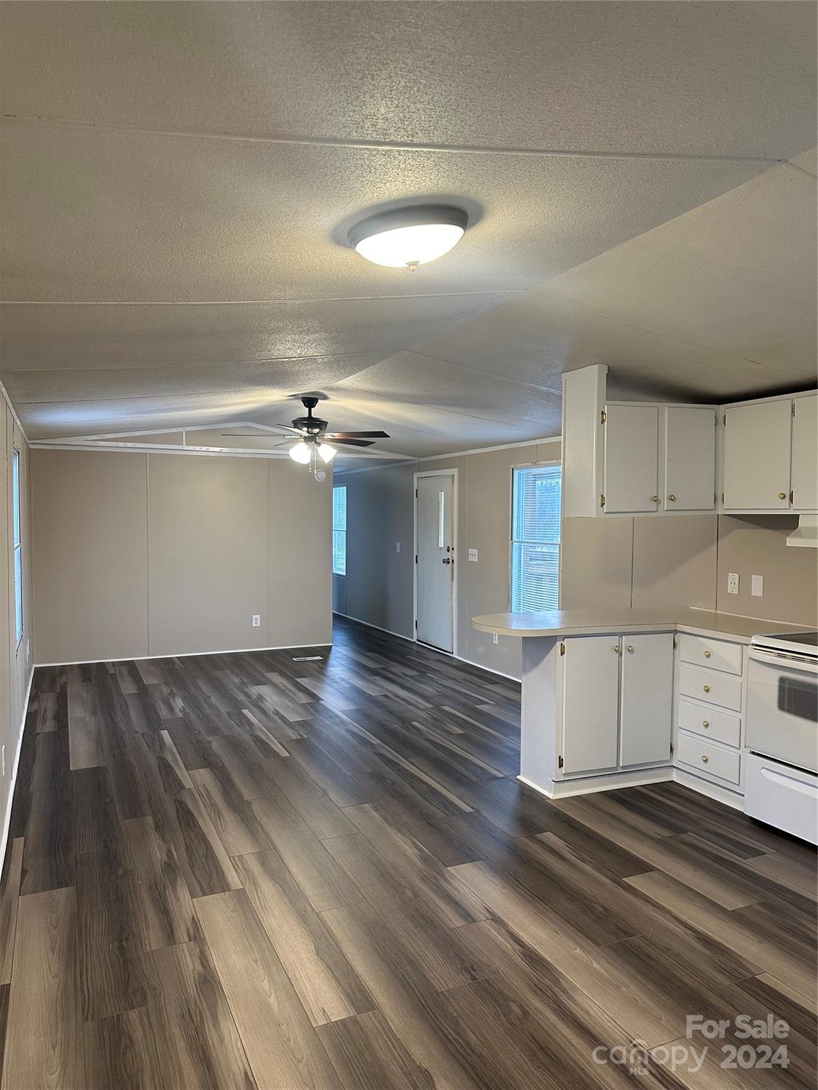 3549 Keystone Drive Sherrills Ford, NC 28673 - Photo 5 of 25 a view of a kitchen with a sink dishwasher stove and cabinets