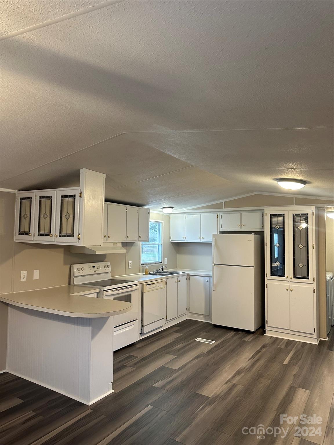 3549 Keystone Drive Sherrills Ford, NC 28673 - Photo 8 of 25 a kitchen with a white cabinets and wooden floor