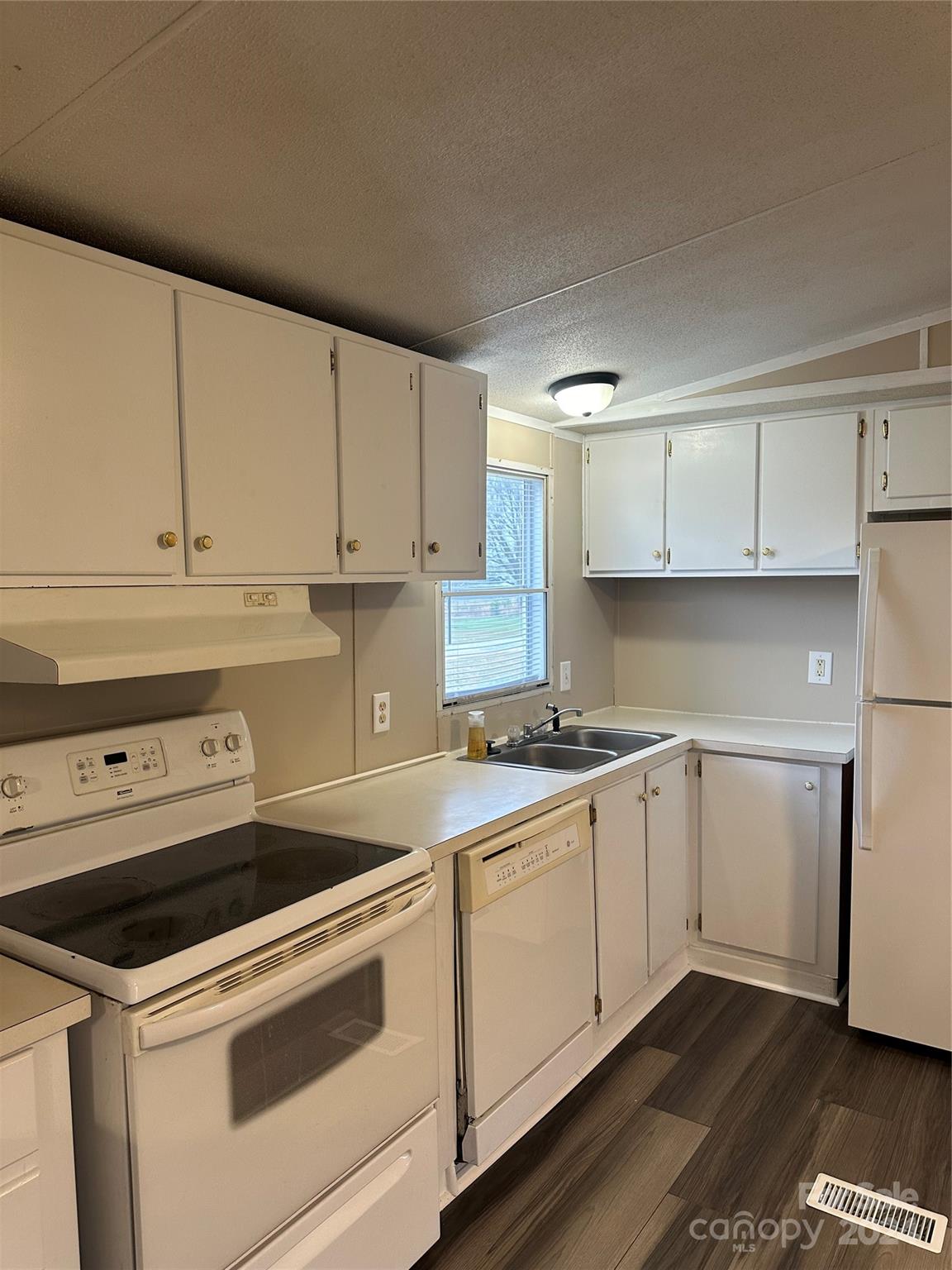 3549 Keystone Drive Sherrills Ford, NC 28673 - Photo 9 of 25 a kitchen with granite countertop white cabinets and white appliances