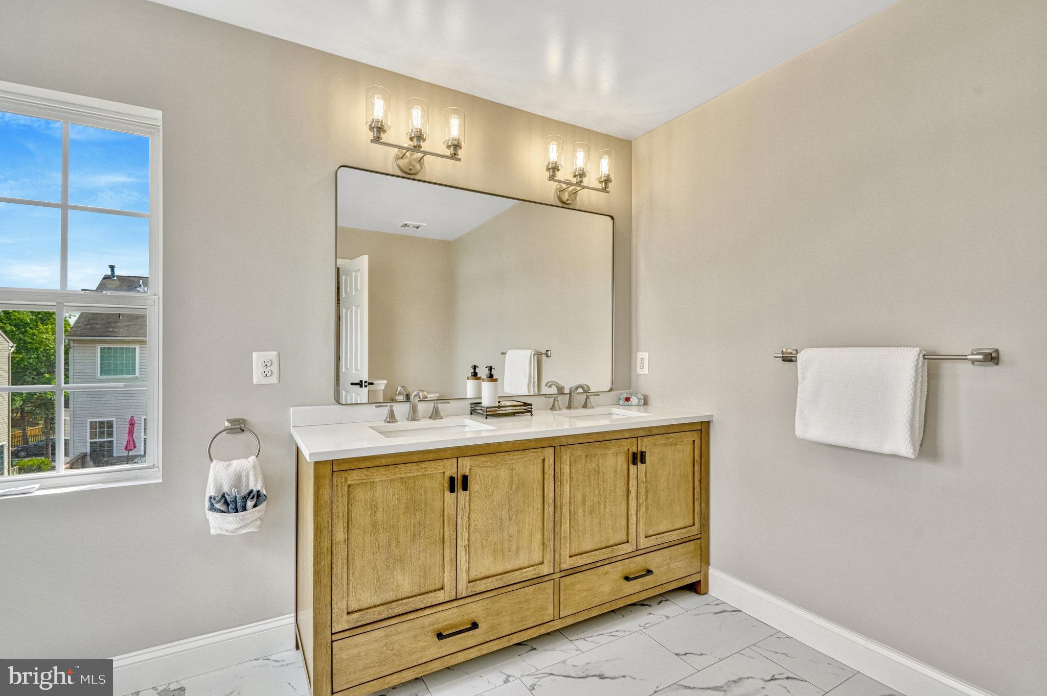 42751 Bennett Street Chantilly, VA 20152 - Photo 30 of 61 a bathroom with a sink vanity and mirror