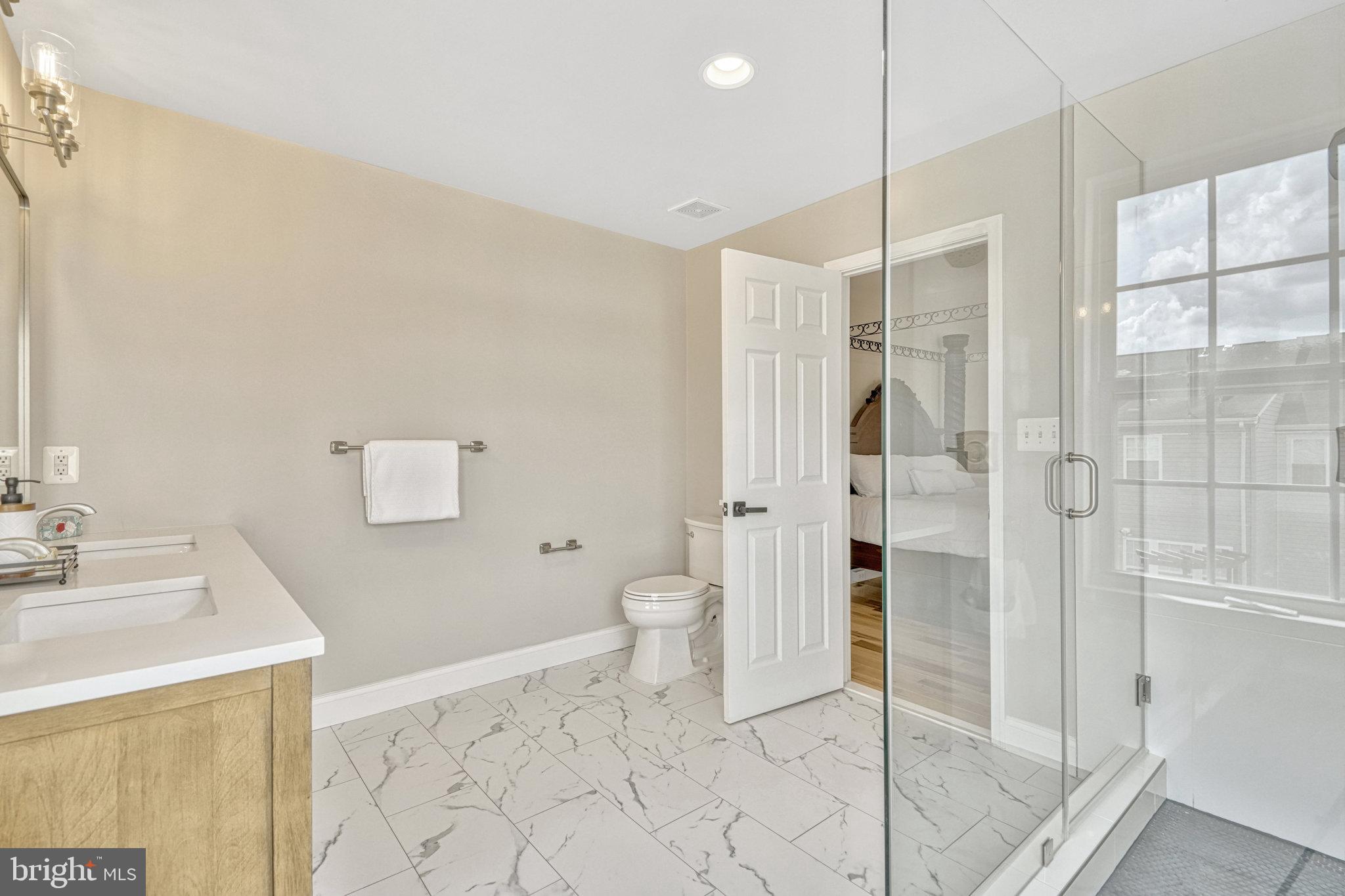 42751 Bennett Street Chantilly, VA 20152 - Photo 32 of 61 a bathroom with a shower toilet and sink