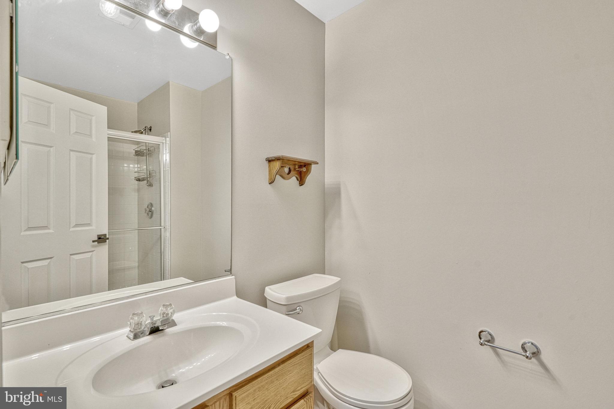 42751 Bennett Street Chantilly, VA 20152 - Photo 42 of 61 a bathroom with a sink toilet and shower