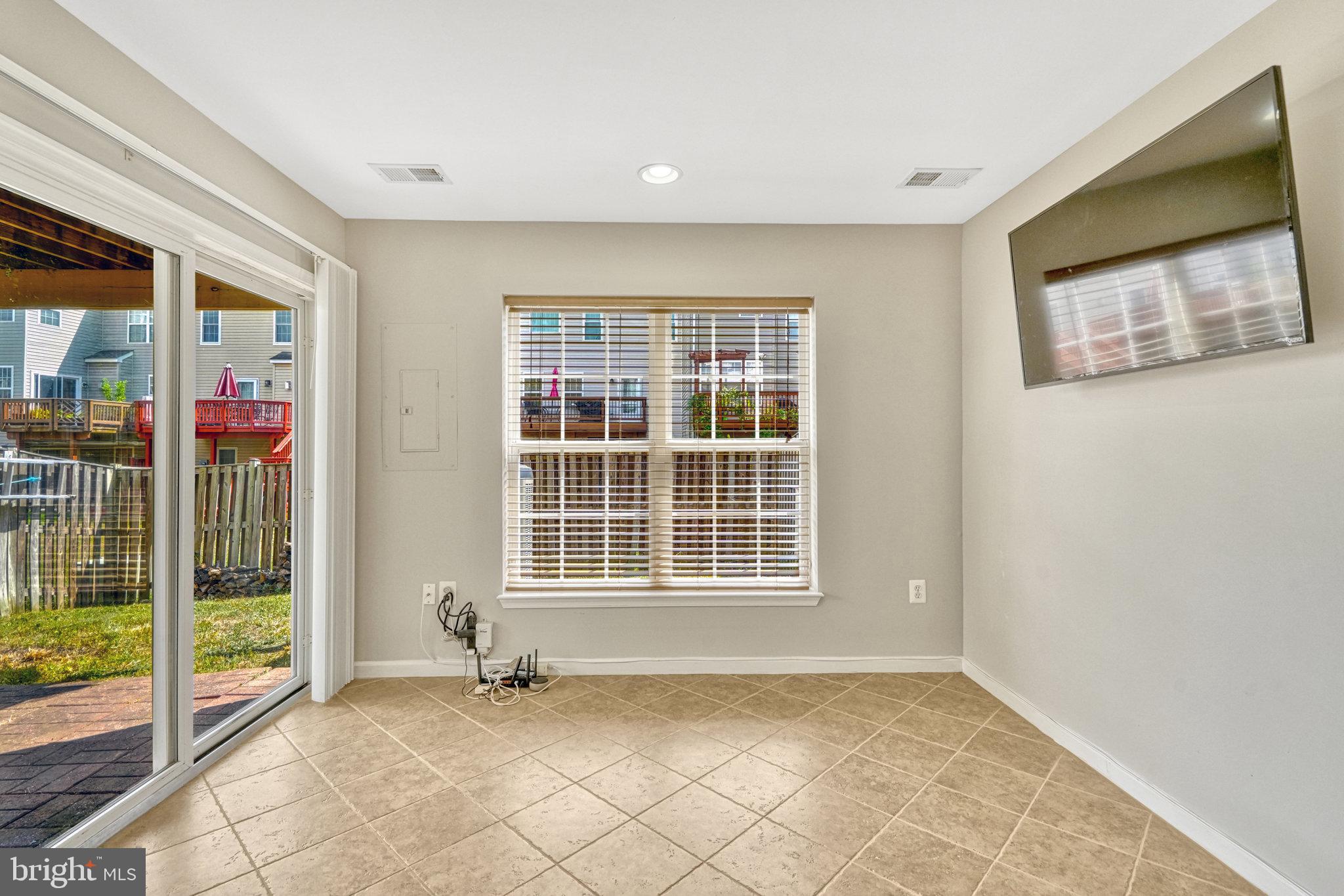 42751 Bennett Street Chantilly, VA 20152 - Photo 43 of 61 a view of an empty room with wooden floor and a window