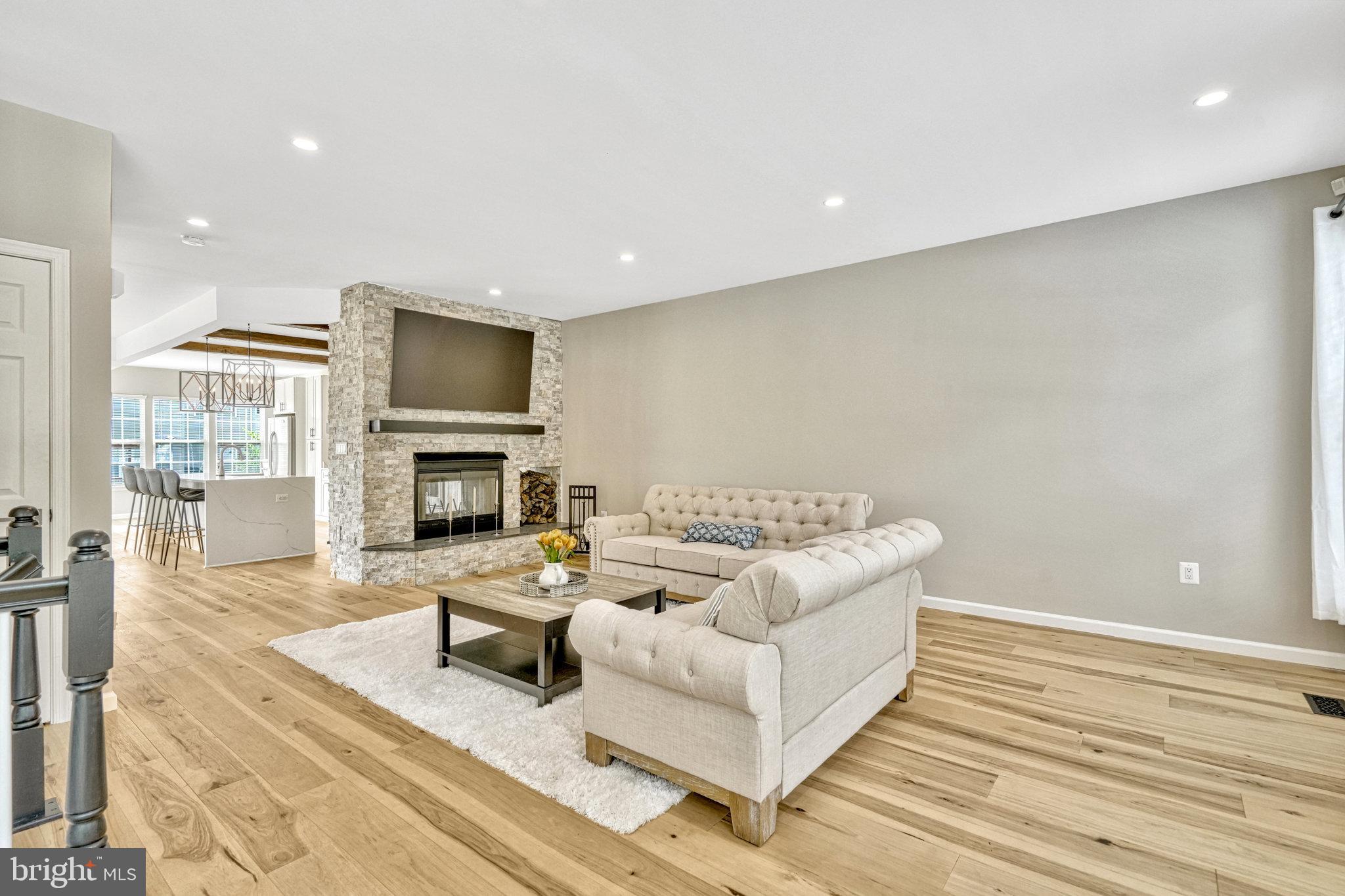 42751 Bennett Street Chantilly, VA 20152 - Photo 5 of 61 a living room with furniture and a fireplace
