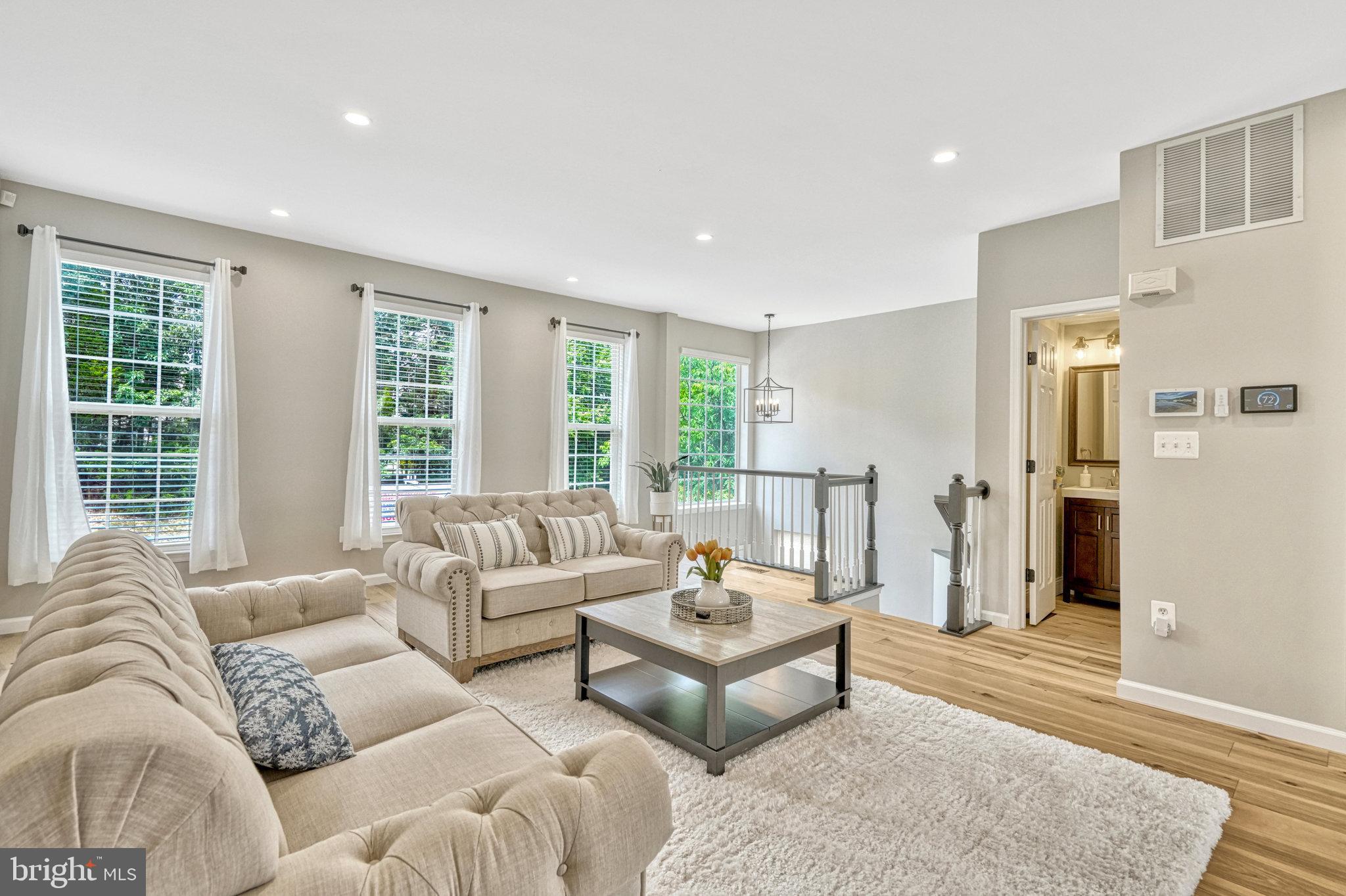 42751 Bennett Street Chantilly, VA 20152 - Photo 7 of 61 a living room with furniture and large windows