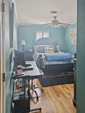 a bedroom with a bed and a table in it