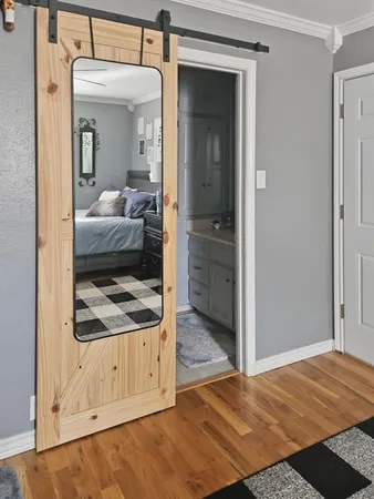 a view of a bedroom from a hallway