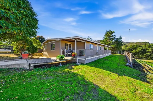 a view of a hallway with a ceiling fan