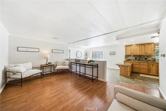 a spacious bathroom with a granite countertop sink mirror vanity and a shower
