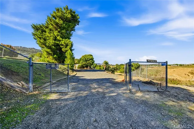 a view of a house with backyard porch and sitting area