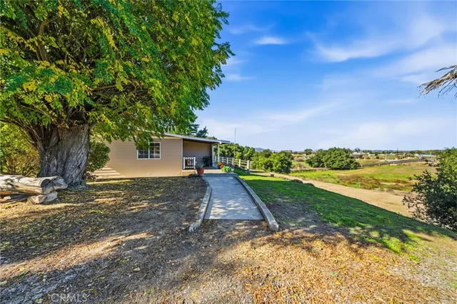 a view of a balcony with wooden floor and outdoor space