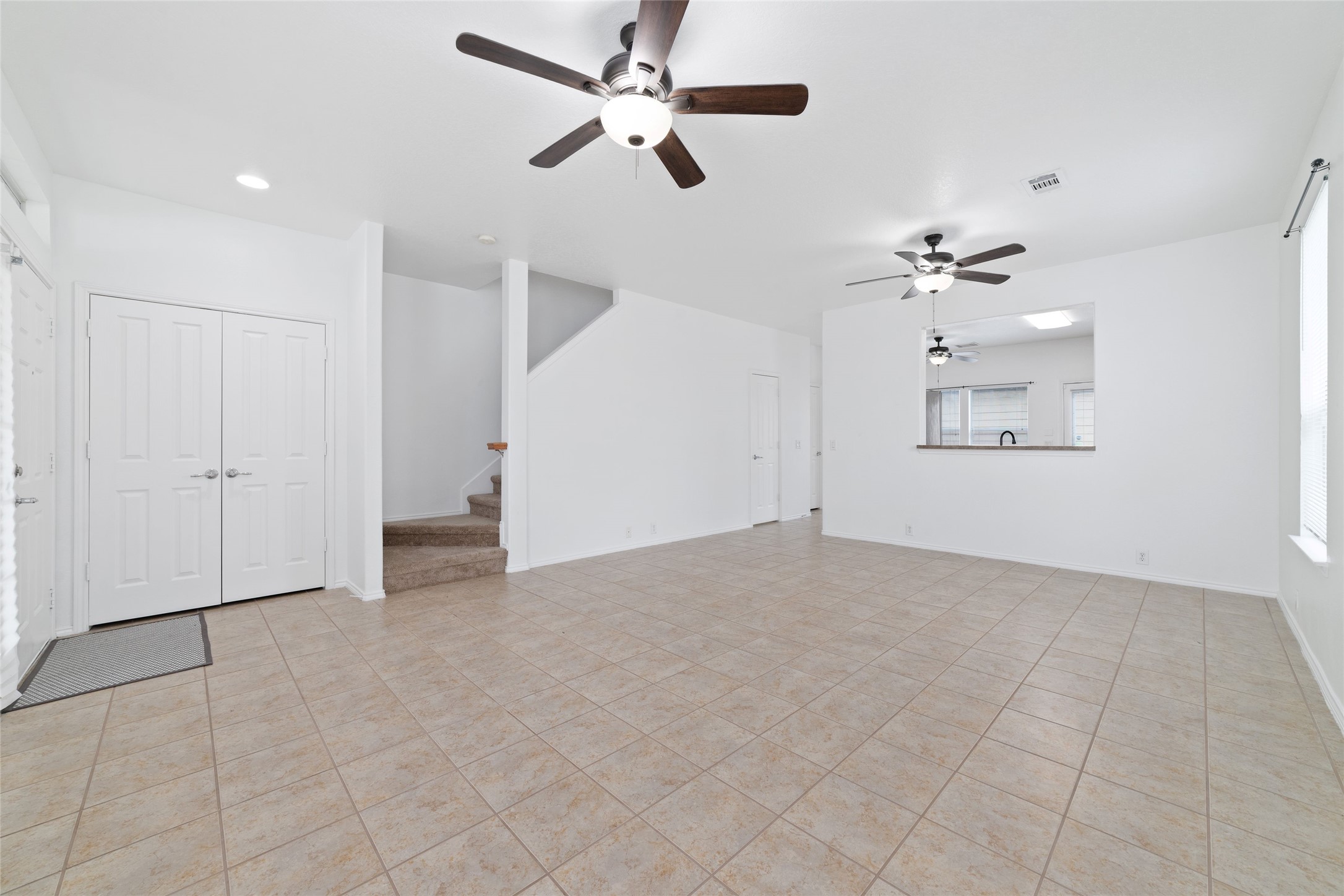 23602 Youpon Lake Lane Spring, TX 77373 - Photo 4 of 21 Spacious open living area with ceiling fans and seamless flow throughout.
