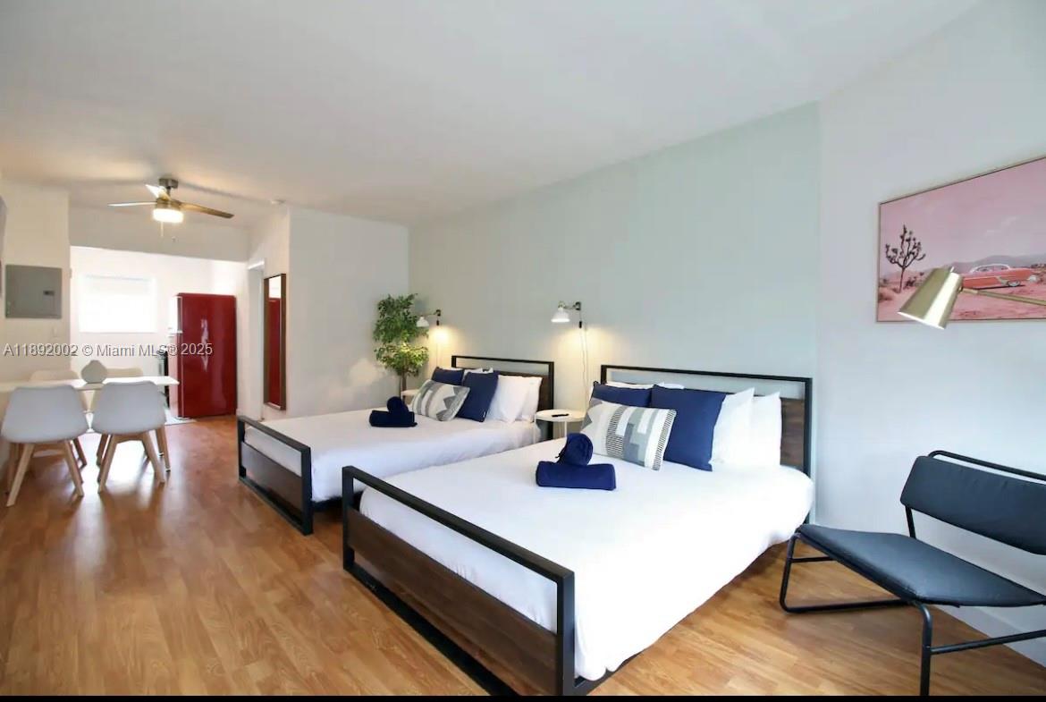 7721 Harding Avenue, Unit 9 Miami Beach, FL 33141 - Photo 1 of 10 a living room with furniture and wooden floor