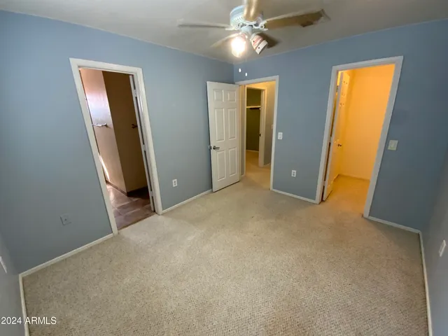 a view of a hallway with closet area