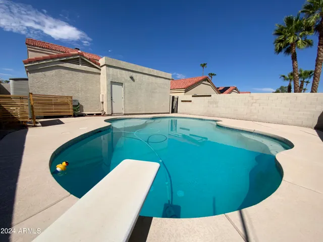 a view of a swimming pool with a patio