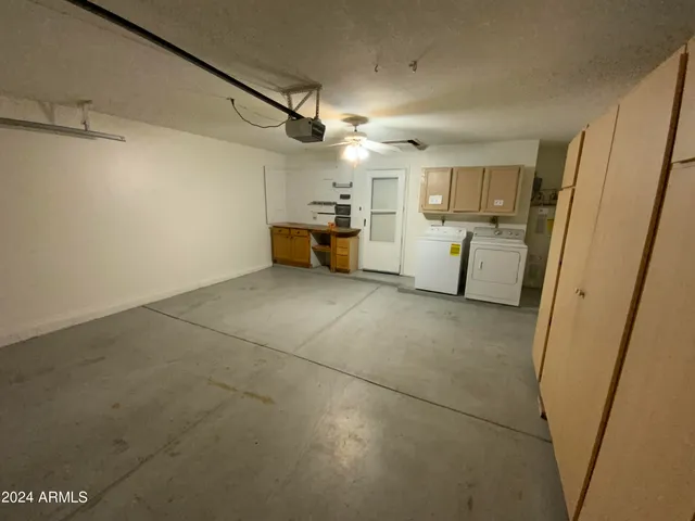 a view of a storage & utility room with a sink