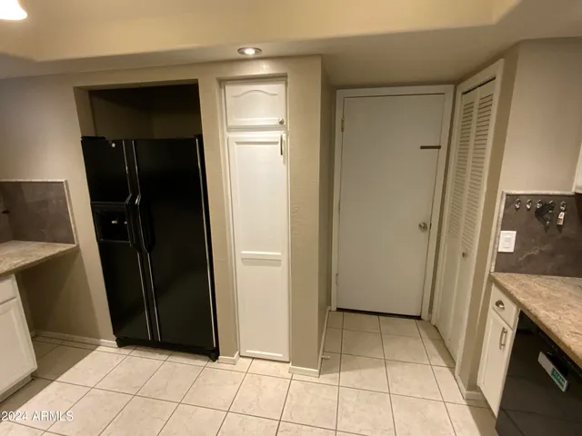 a view of a utility room with washing machine