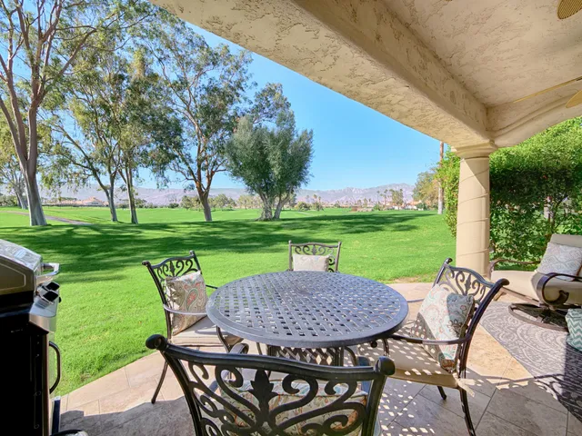 a view of a patio with garden