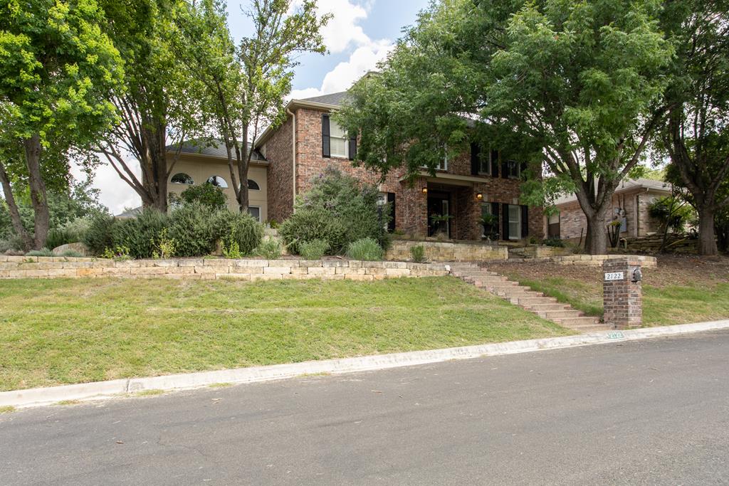 2122 West Bluff Drive Kerrville, TX 78028 - Photo 1 of 1 a swimming pool with outdoor seating and yard