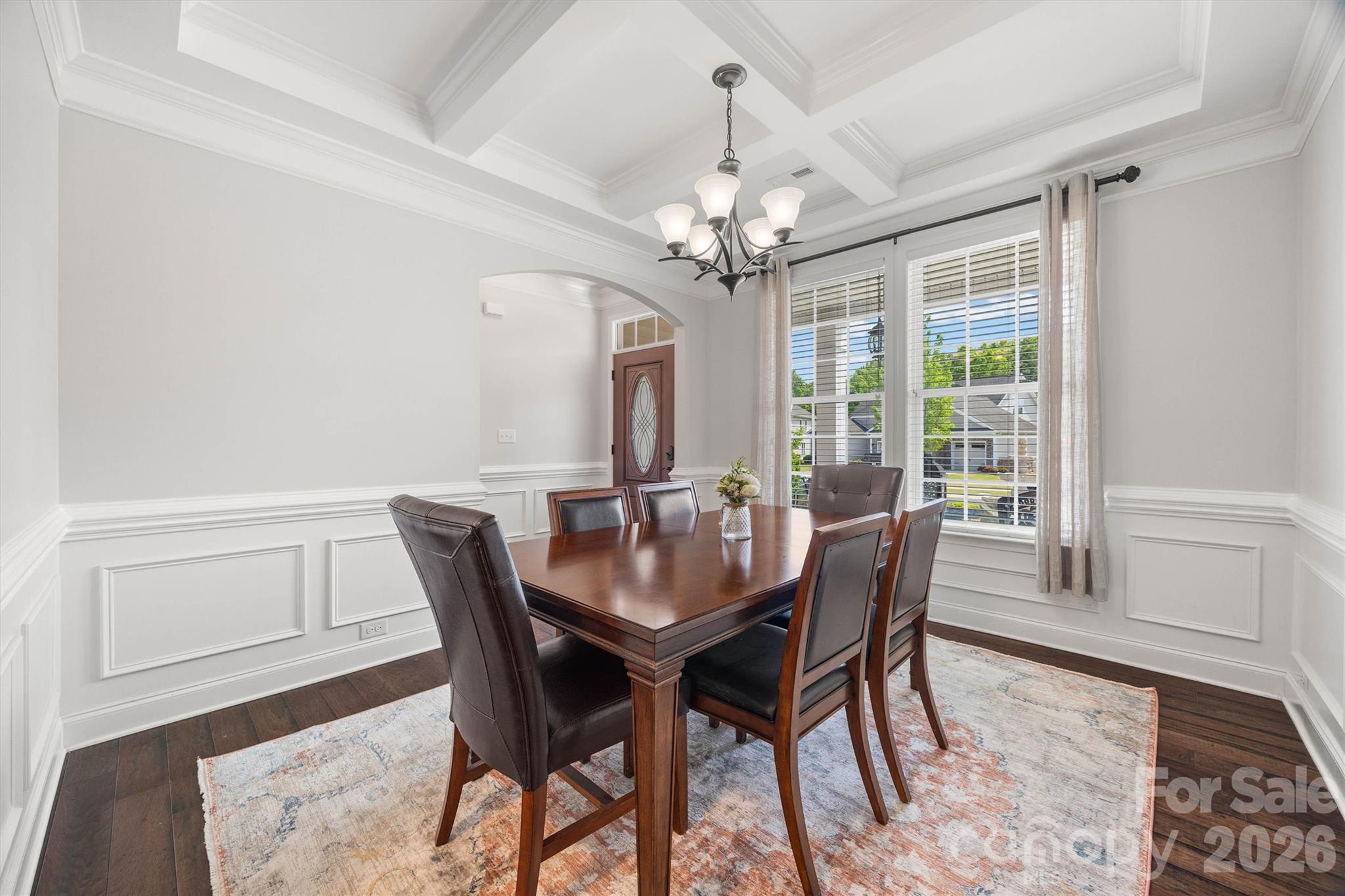 299 Annatto Way Tega Cay, SC 29708 - Photo 7 of 46 a view of a dining room with furniture window and wooden floor