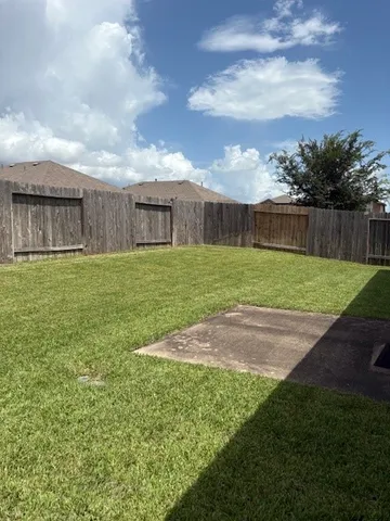 a view of a yard in front of a house
