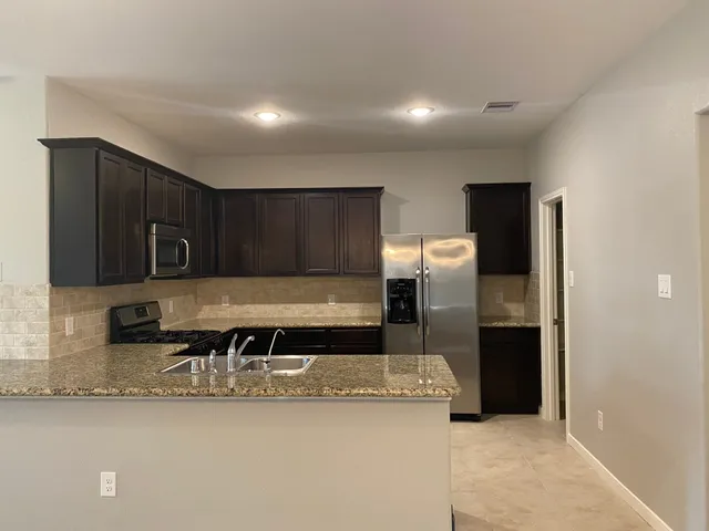 a view of a kitchen with a sink