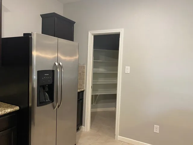 a bathroom with a glass door shower