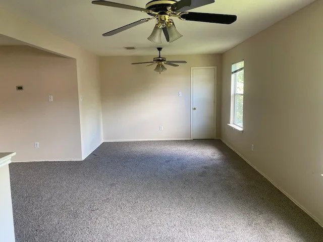 wooden floor in a hall with a window