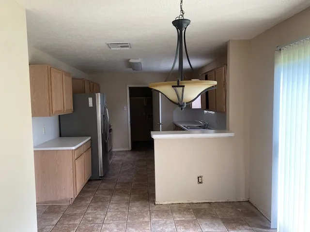 a view of a kitchen with a sink