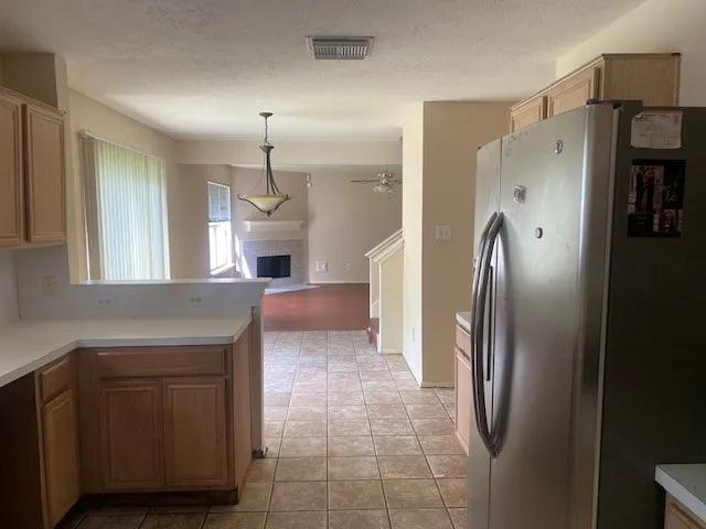 a kitchen with stainless steel appliances a refrigerator and a sink