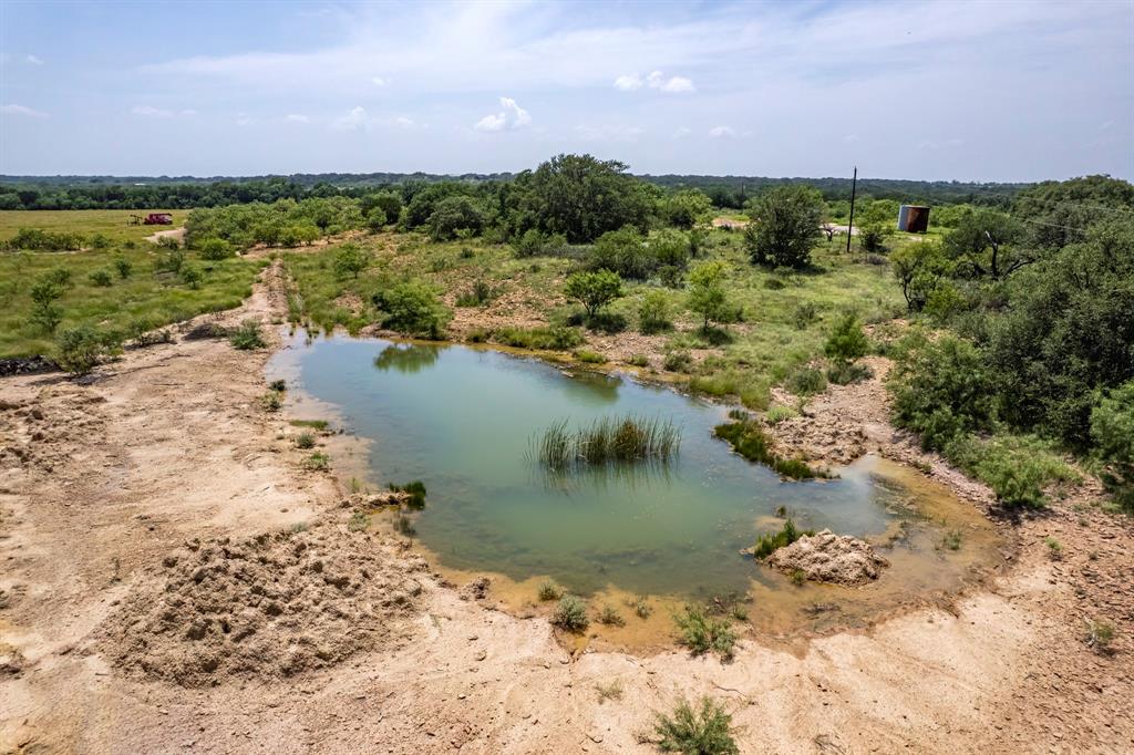 196 County Road 196 Bangs, TX 76823 - Photo 18 of 27 a view of a lake with a mountain in the background