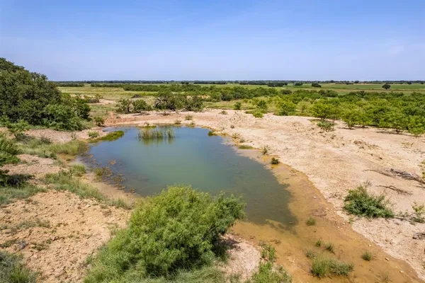 a view of a lake with a beach