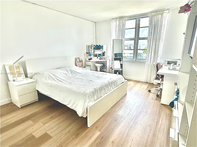a bathroom with a sink mirror bathtub and toilet