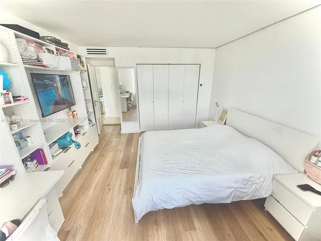 a bathroom with a tub and shower