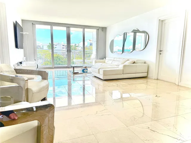 a living room with a large window and a table