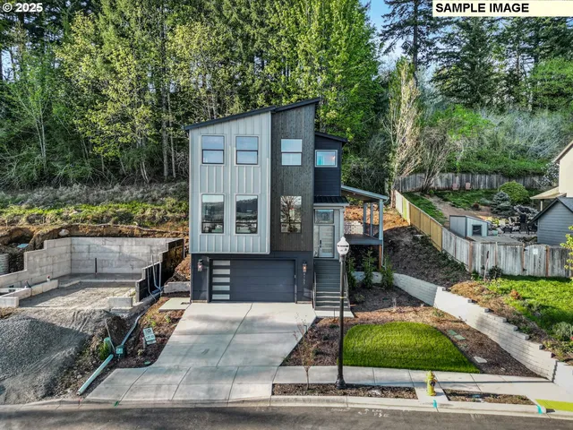 a view of house along with deck and yard