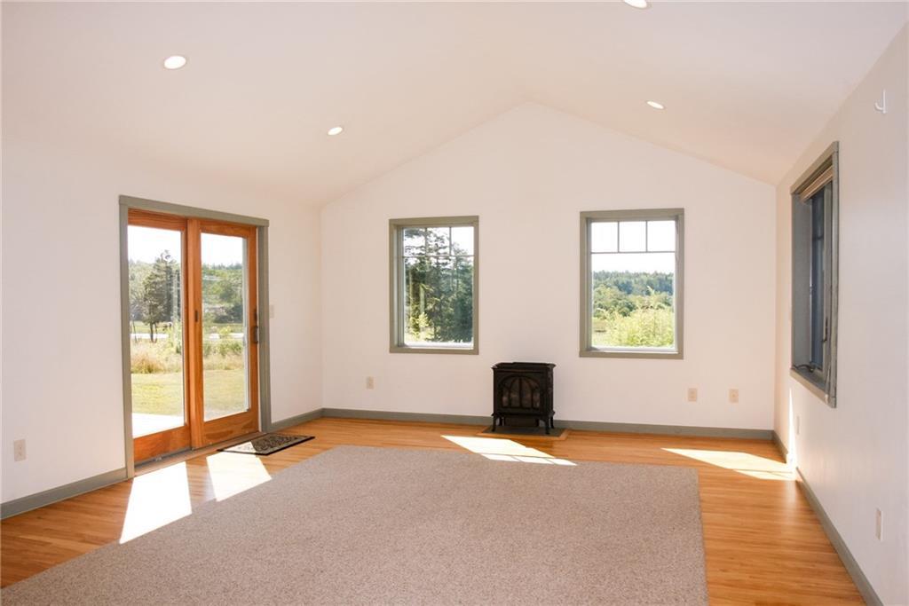 242 Mooseneck Road Addison, ME 04606 - Photo 14 of 35 The airy and sun filled living room...