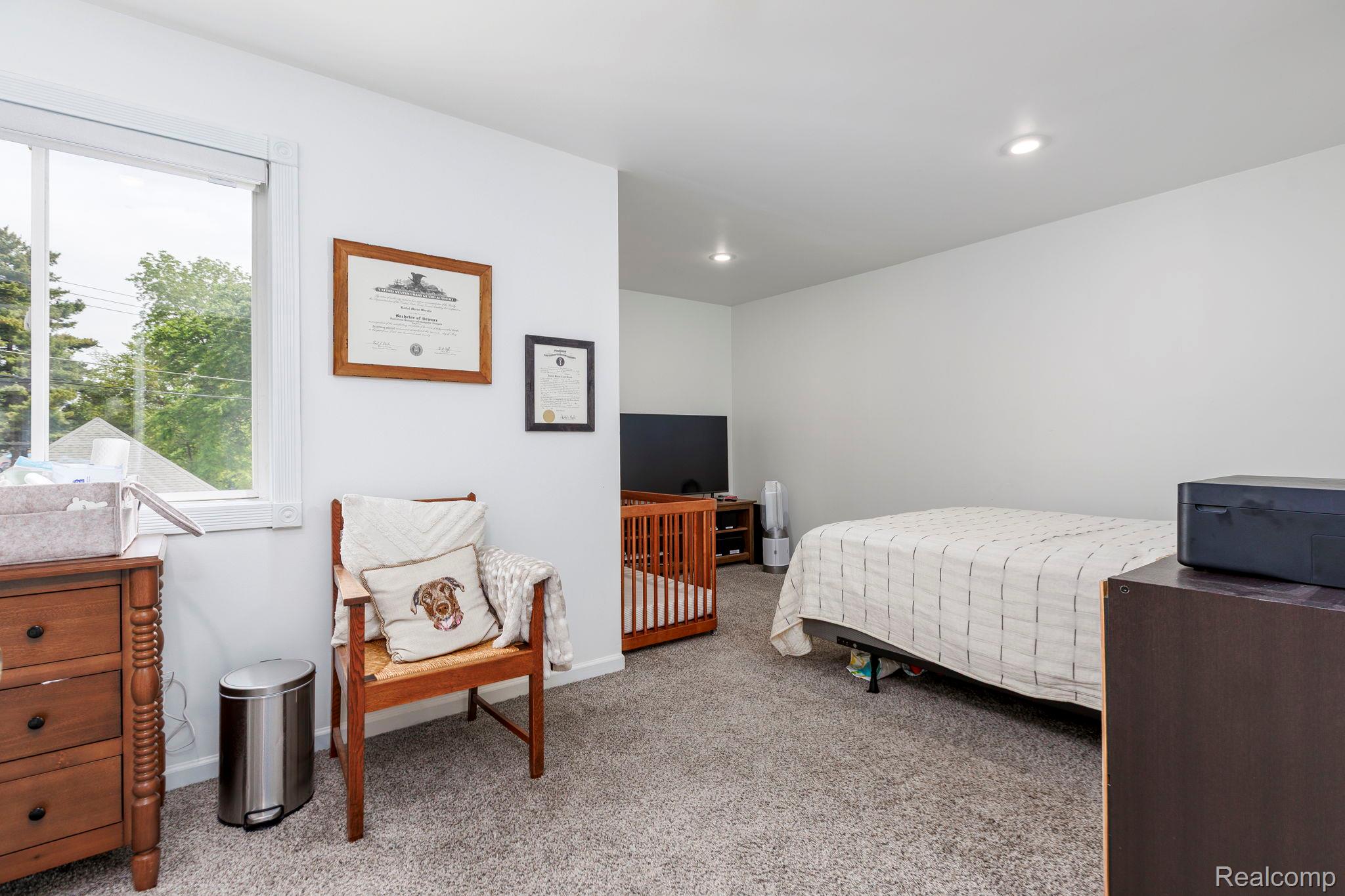 401 Pointe Tremble Road Algonac, MI 48001 - Photo 36 of 40 Spacious bedroom featuring light neutral walls and recessed lighting