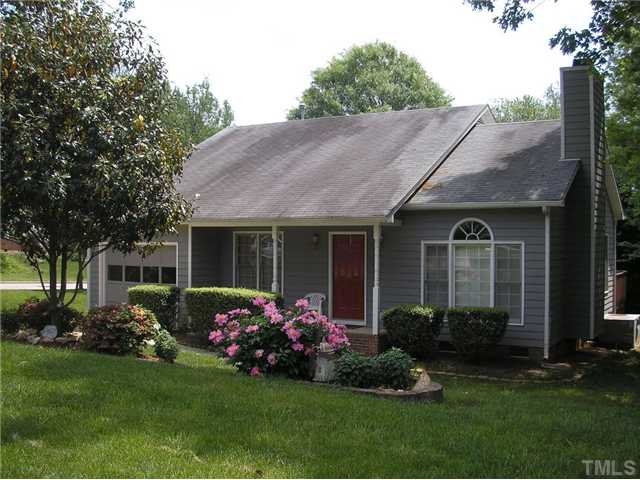 6301 Cape Charles Drive Raleigh, NC 27617 - Photo 1 of 19 a front view of a house with a garden