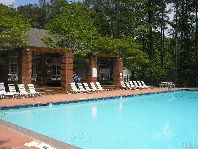 6301 Cape Charles Drive Raleigh, NC 27617 - Photo 15 of 19 a view of a house with swimming pool and sitting area