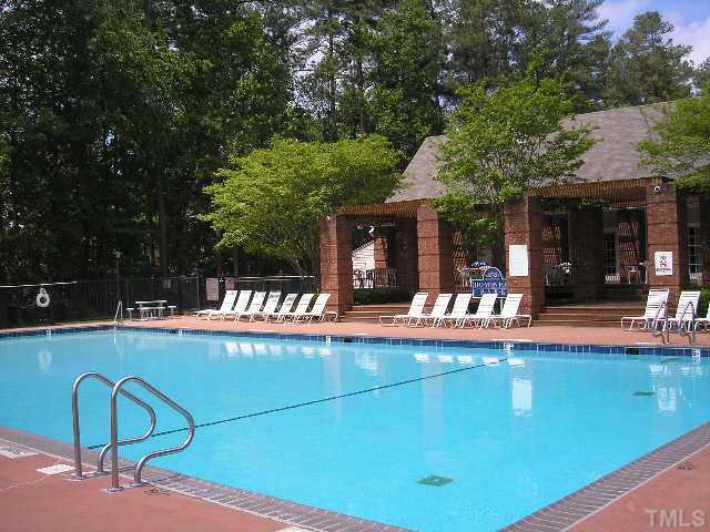 6301 Cape Charles Drive Raleigh, NC 27617 - Photo 16 of 19 a view of a swimming pool with a patio