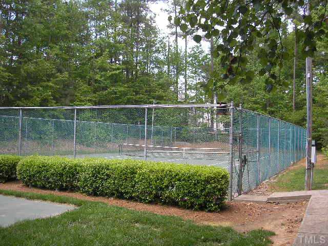 6301 Cape Charles Drive Raleigh, NC 27617 - Photo 18 of 19 a view of a backyard with a garden