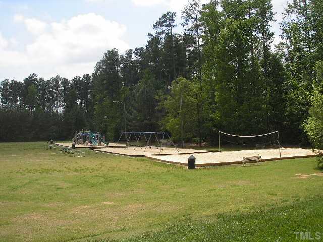 6301 Cape Charles Drive Raleigh, NC 27617 - Photo 19 of 19 a view of a swimming pool with a yard