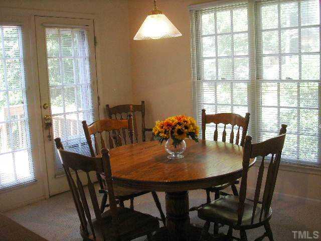 6301 Cape Charles Drive Raleigh, NC 27617 - Photo 6 of 19 a view of a dining room with furniture and window