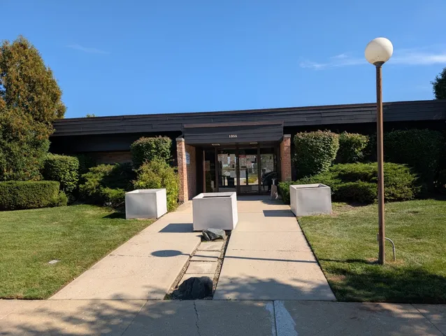 a view of an empty room with closet area