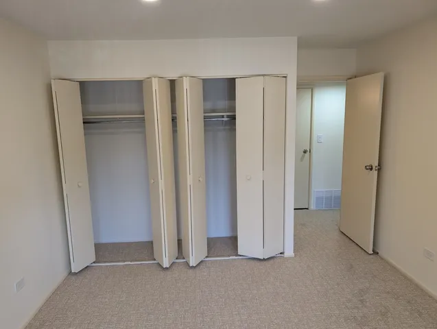 a view of a playground with basketball court