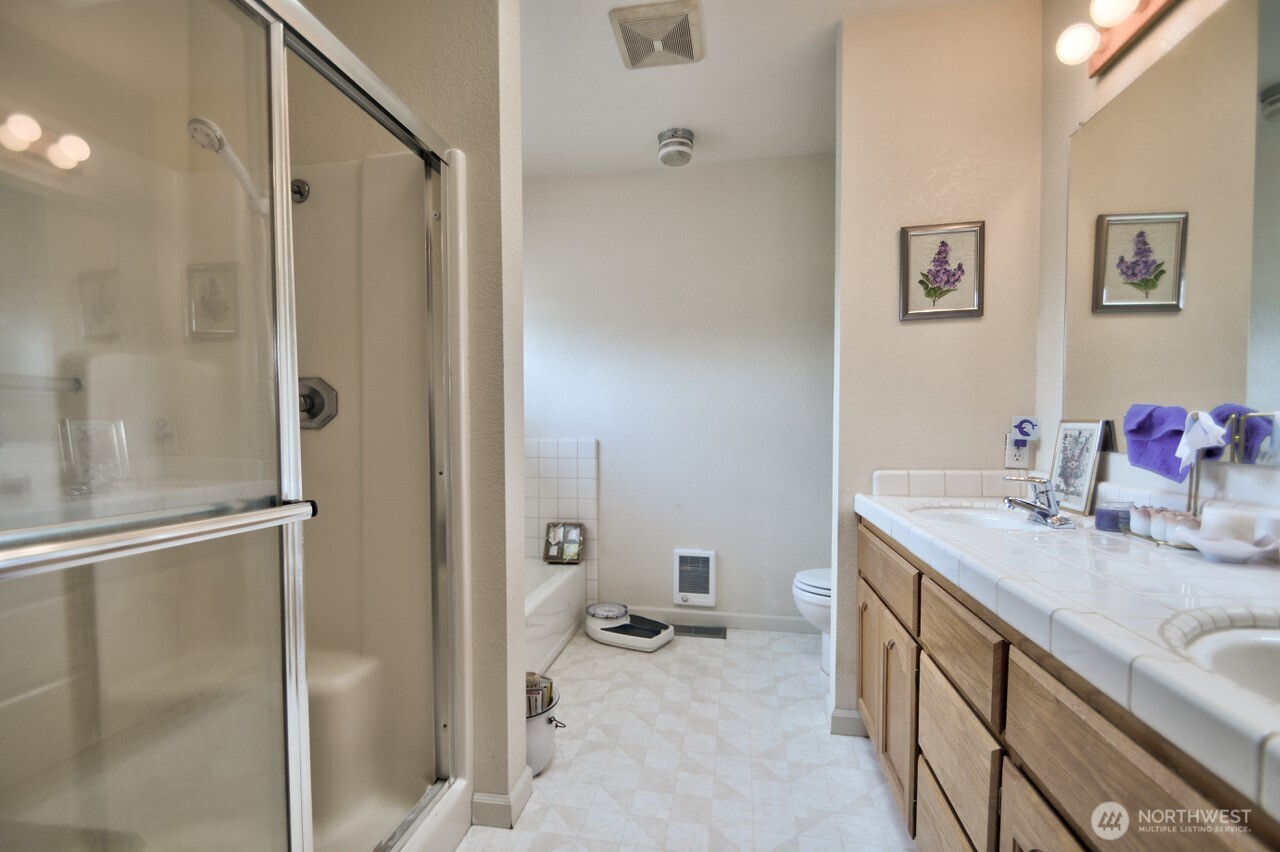 378 Burnt Ridge Road Onalaska, WA 98570 - Photo 21 of 40 a bathroom with a granite countertop sink mirror and shower