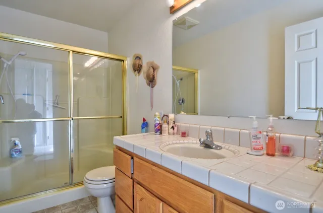 a utility room with cabinets washer and dryer