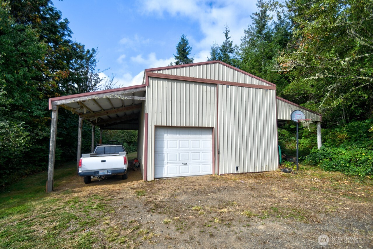 378 Burnt Ridge Road Onalaska, WA 98570 - Photo 35 of 40 a front view of a house with a garden