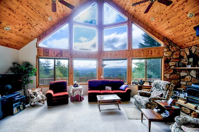 a living room with patio furniture and a potted plants